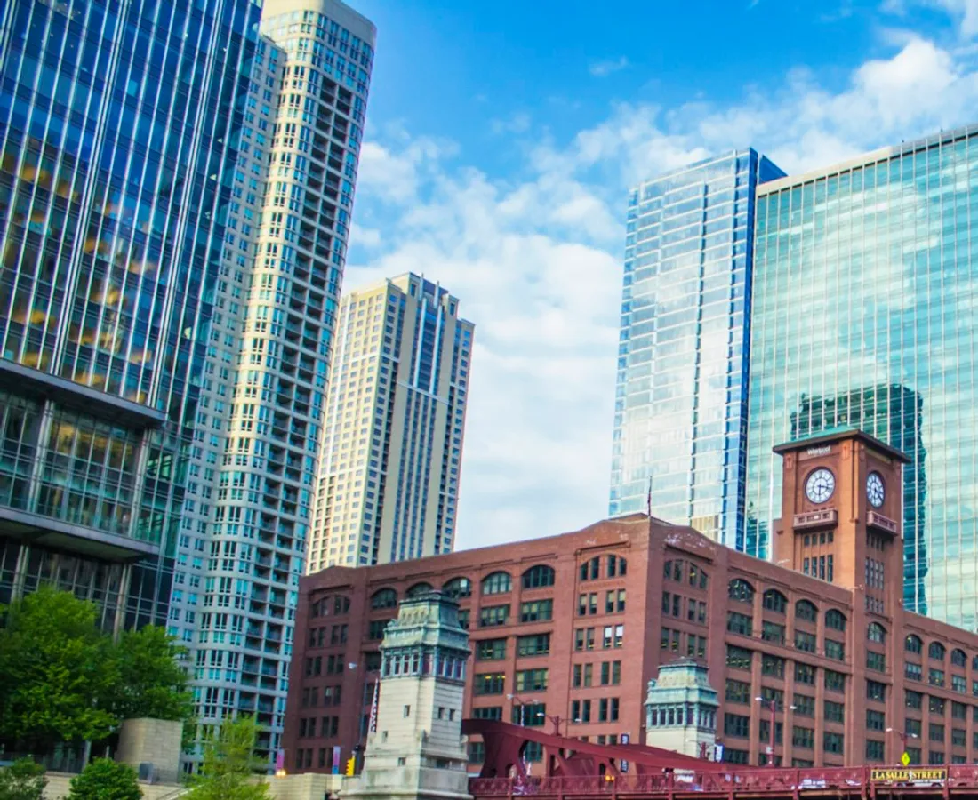 The LaSalle Street bridge over the Chicago River with the Reid Murdoch clock tower and glass towers behind